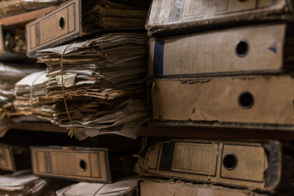 Old,Dusty,Stack,Of,Papers,,Files,,Documents,On,The,Shelves